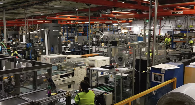 Prime Factory of Machines and People Working - Tablet Size